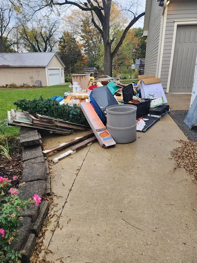 Dumpster being loaded with debris for 10 Yard Dumpster Rental in Marrero